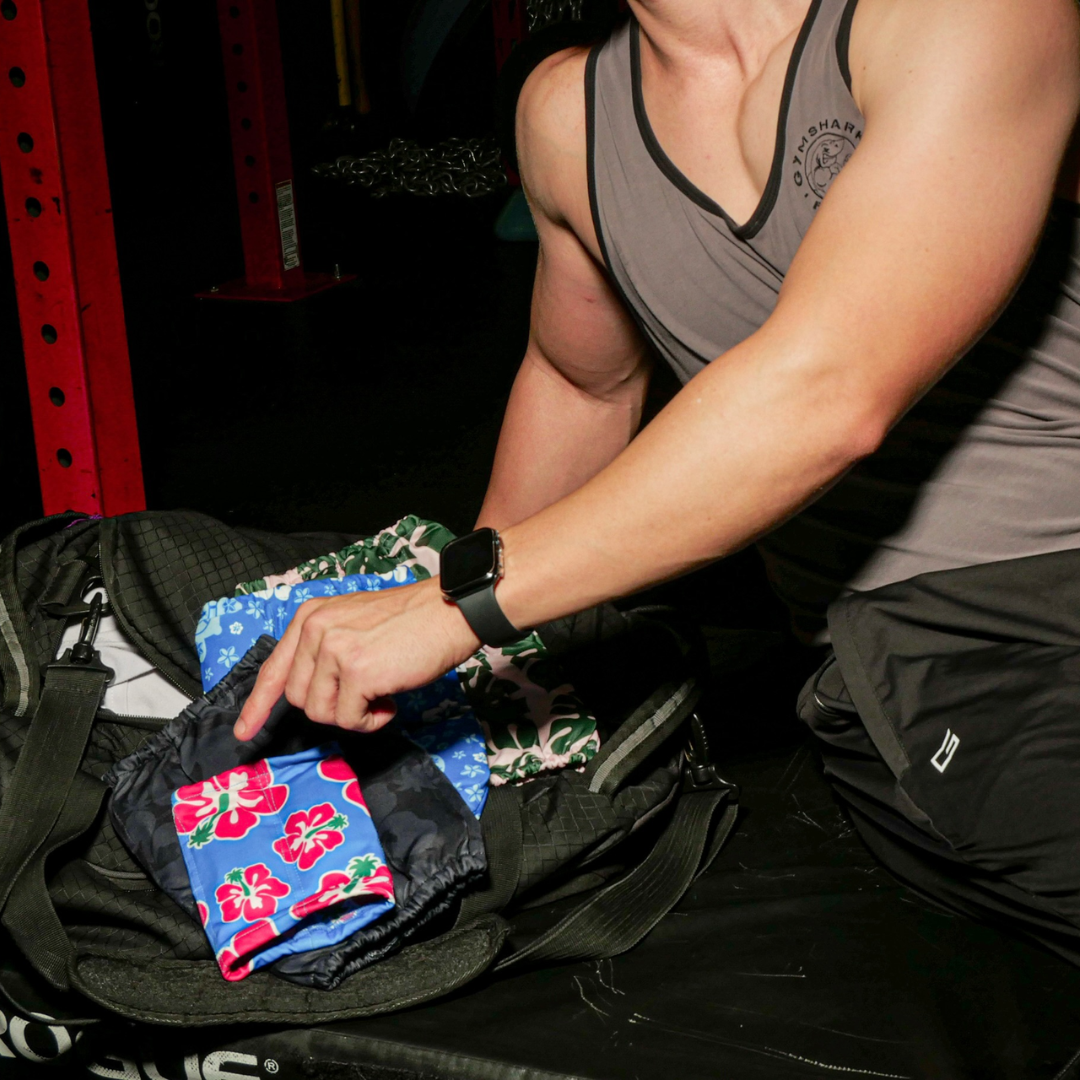 A woman stretching and smiling while wearing a HurtSkurt wearable ice pack.