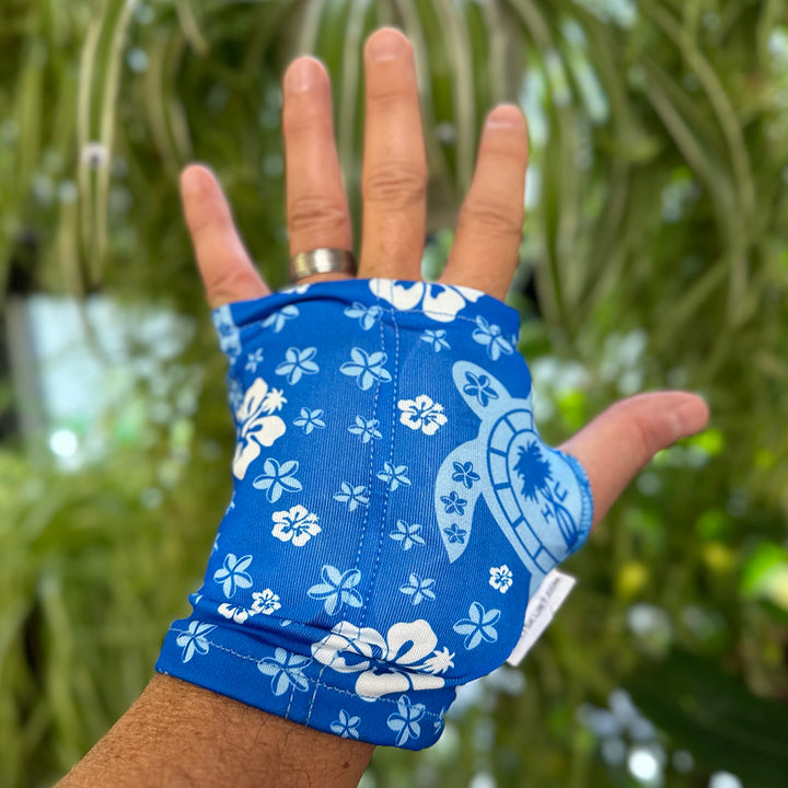 An image of a man wearing HurtSkurt's small blue wearable ice pack for hand and wrist pain relief.