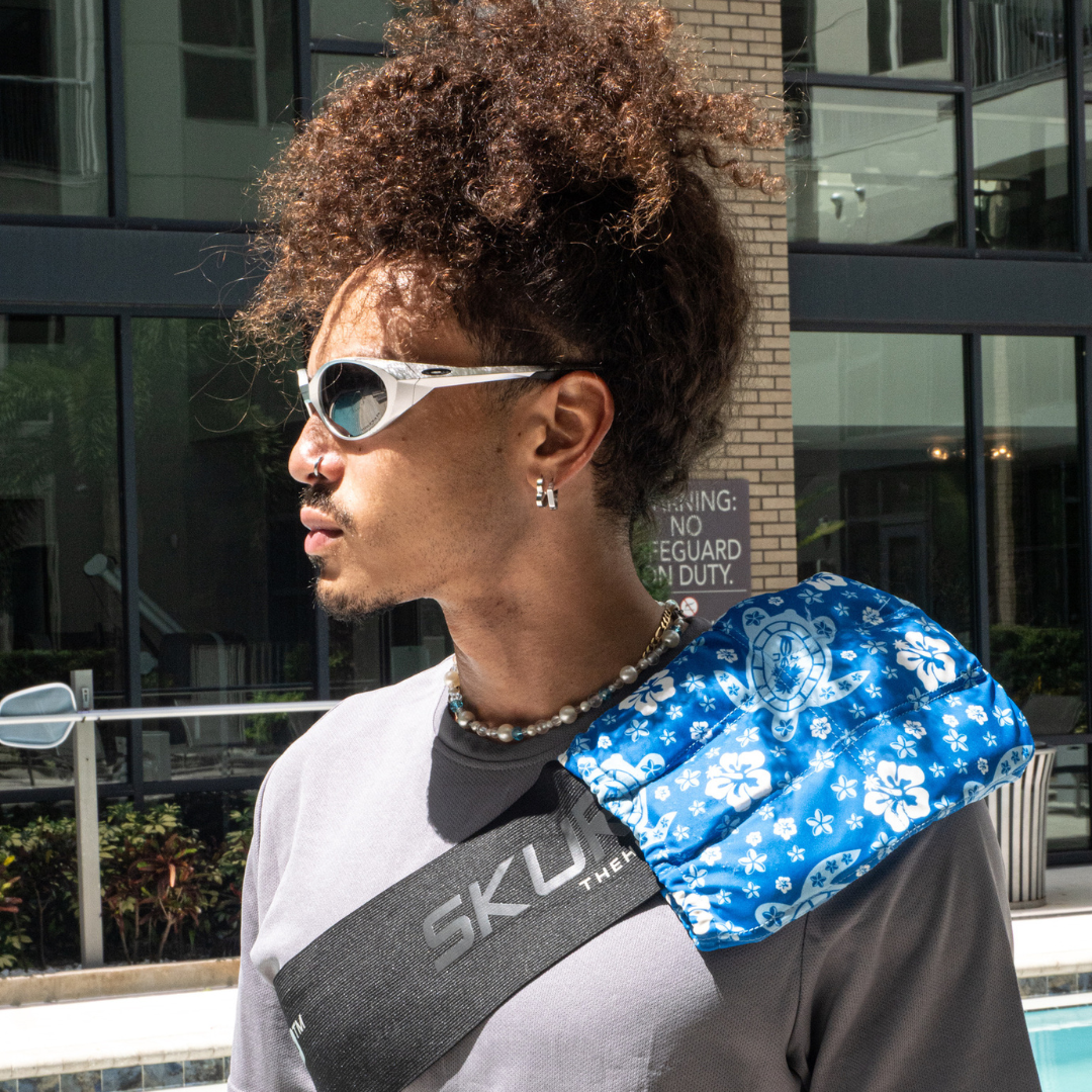 Man wearing a Large HurtSkurt on his shoulder with a SkurtStrap to relieve his frozen shoulder symptoms