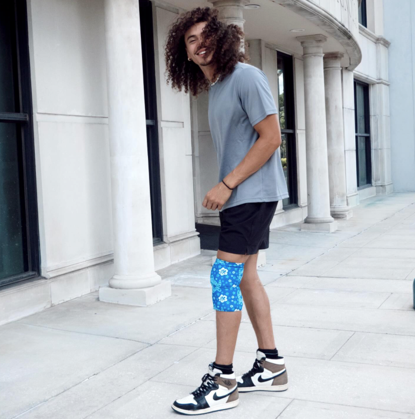 Man wearing a HurtSkurt® on his knee to relieve pain from running