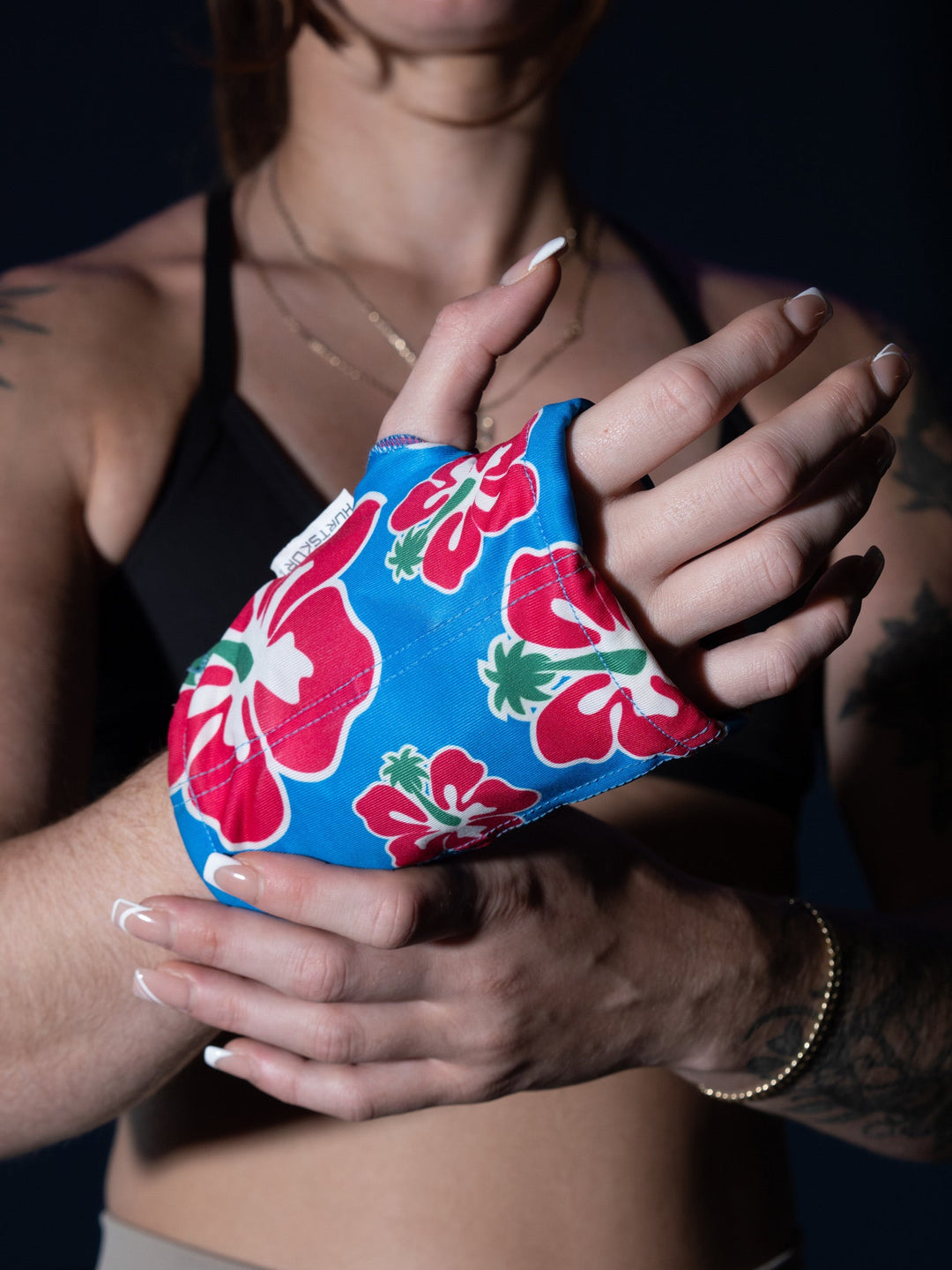 Woman wearing small HurtSkurt on her hand to aid arthritis pain