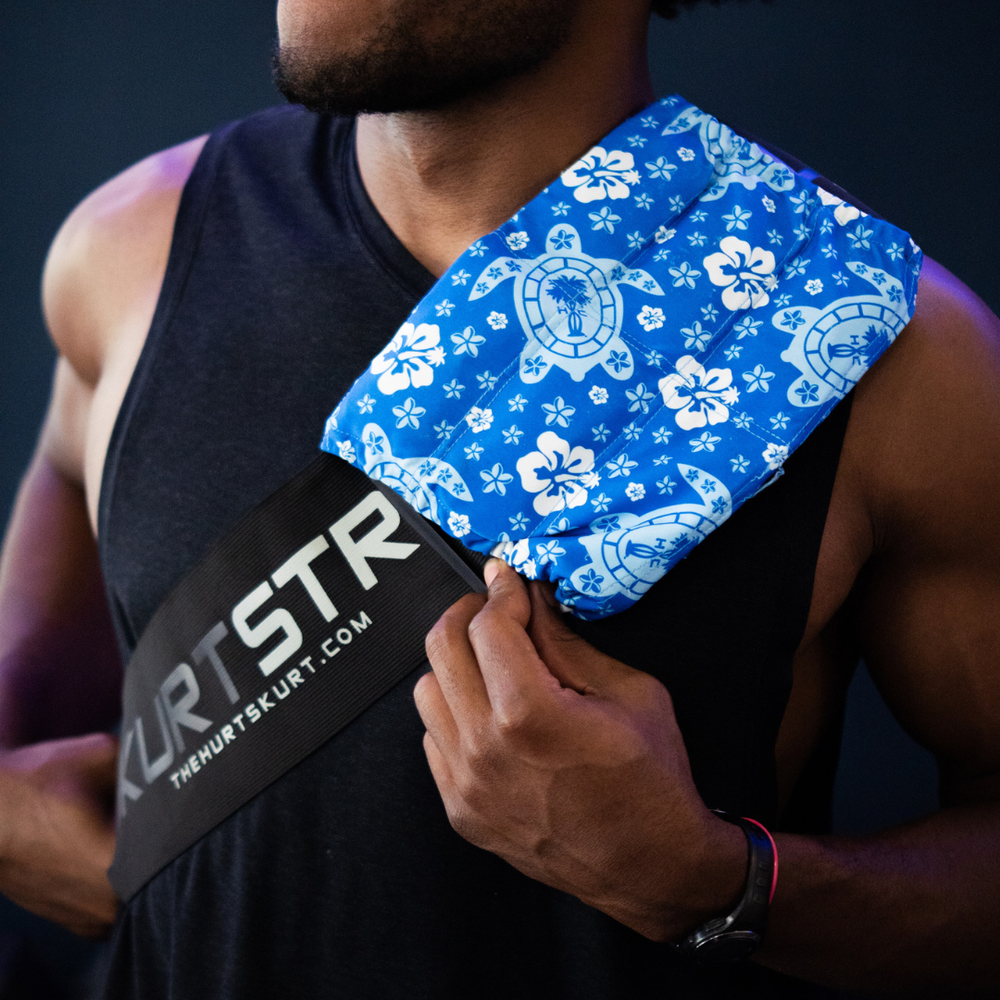 Man treating his sore shoulder with a HurtSkurt® and a SkurtStrap accessory to ease shoulder pain